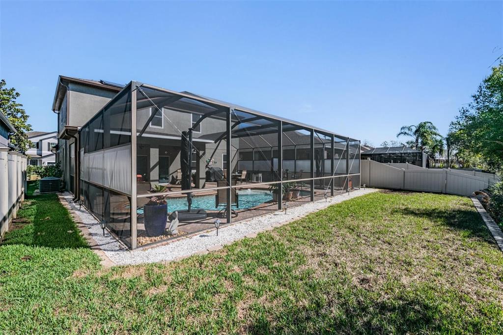 12902 Tikal Way Trinity, FL 34655 - Photo 34 of 43 a view of backyard with a garden and deck