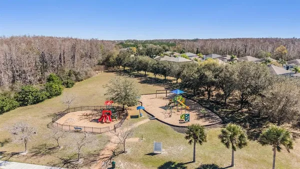 a view of a swimming pool with a yard