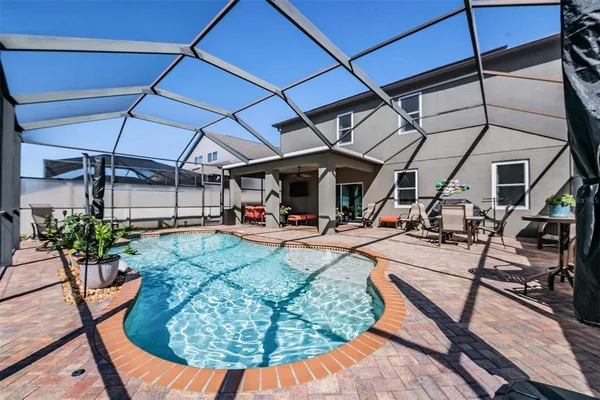 a view of a swimming pool with a patio