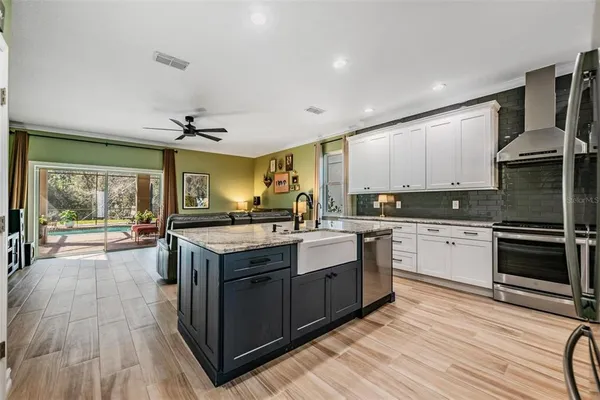 a kitchen with a stove a sink and a refrigerator