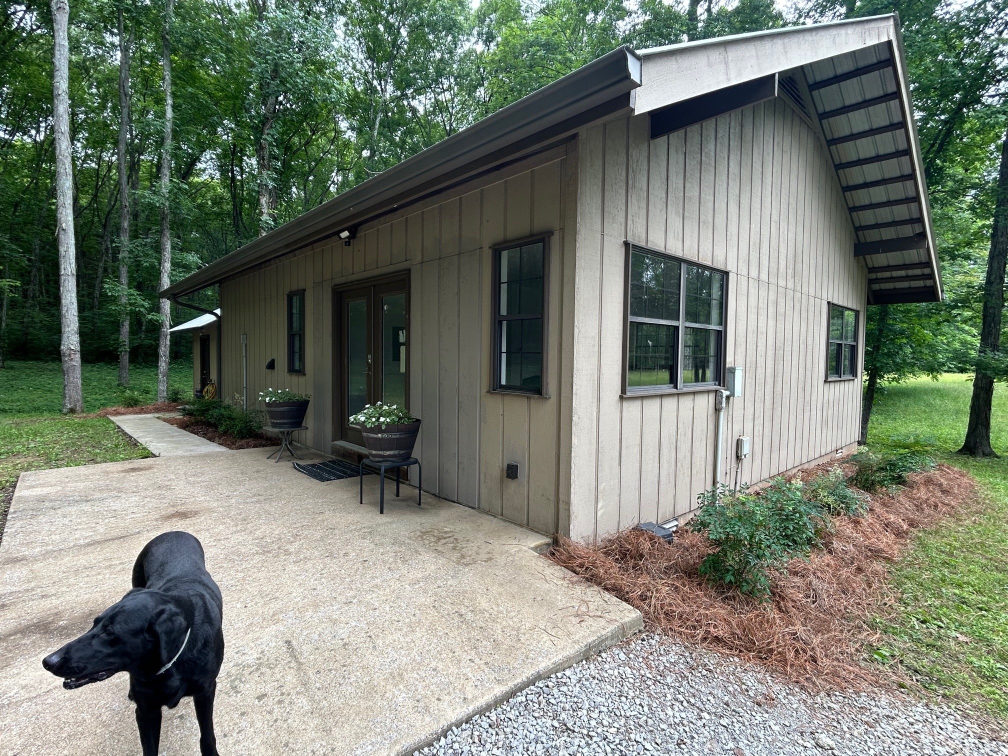 6960 Millersburg Road Christiana, TN 37037 - Photo 33 of 68 a backyard of a house with barbeque oven and outdoor seating