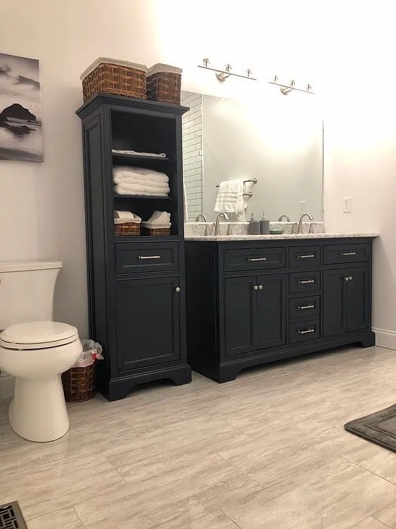 6960 Millersburg Road Christiana, TN 37037 - Photo 36 of 68 a bathroom with a toilet sink and mirror