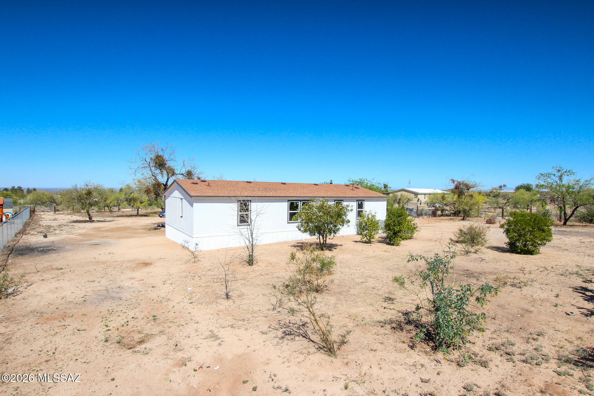 14303 West Rolina Lane Tucson, AZ 85736 - Photo 33 of 38 a view of a dry yard with a house