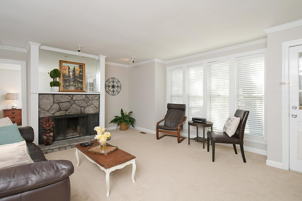 5903 Sentinel Drive Raleigh, NC 27609 - Photo 3 of 26 Family Room with stone fireplace and crown molding. Family Room