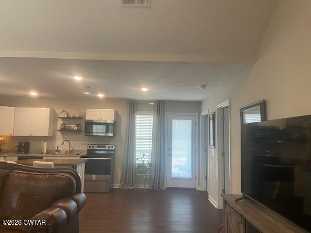 8046 Pillow Street Milan, TN 38358 - Photo 11 of 22 a kitchen with stainless steel appliances granite countertop a refrigerator and a stove