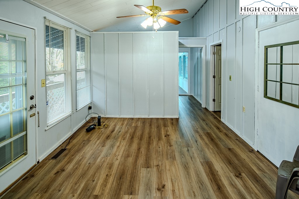 261 Black Pine Road Newland, NC 28657 - Photo 13 of 41 a view of a hallway with wooden floor and staircase