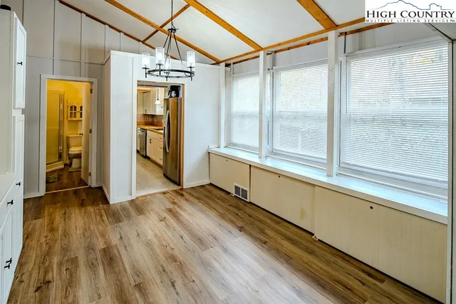 a kitchen with stainless steel appliances a stove a refrigerator and a sink