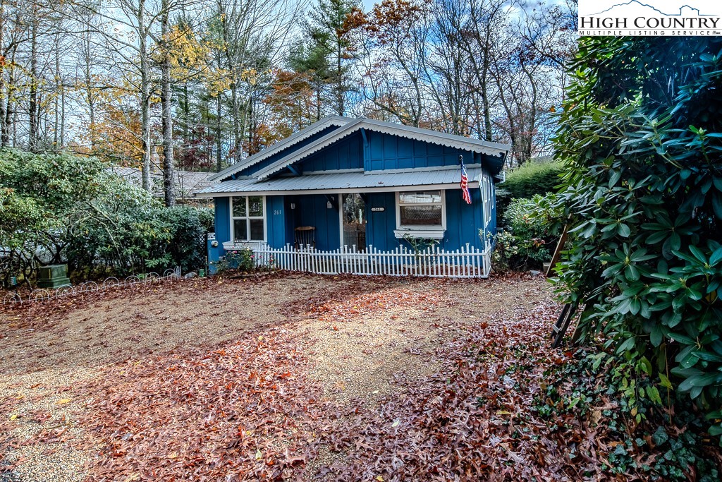 261 Black Pine Road Newland, NC 28657 - Photo 2 of 41 a front view of house with yard and trees around