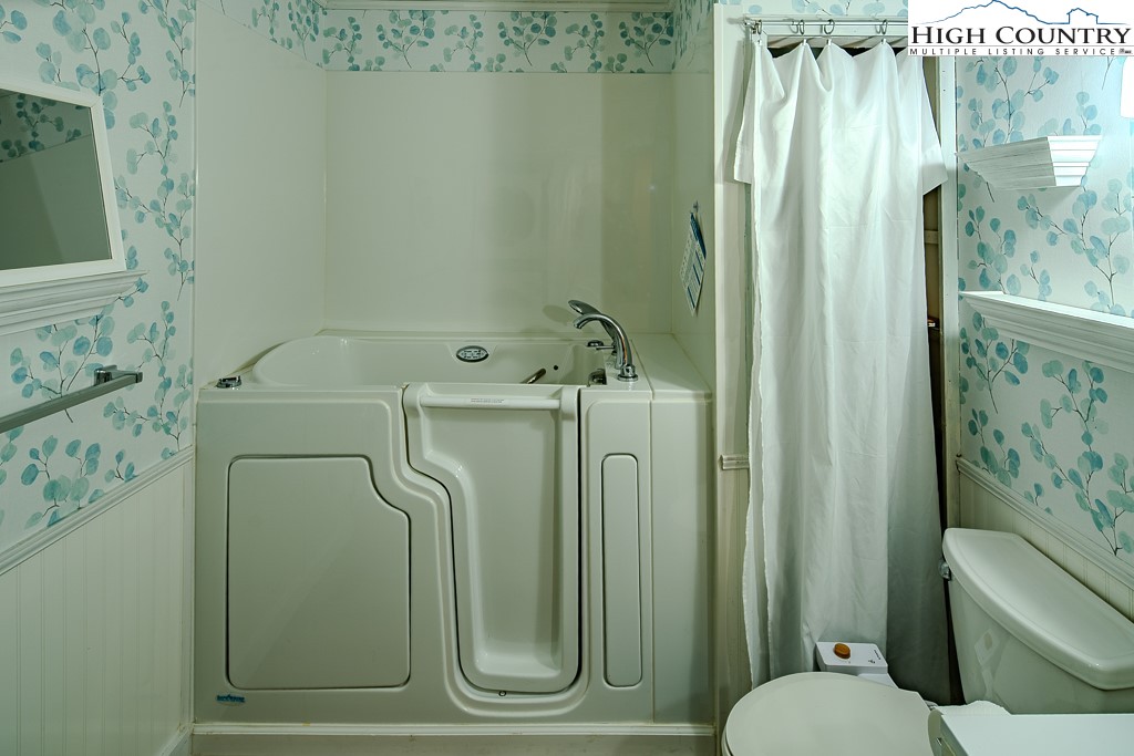 261 Black Pine Road Newland, NC 28657 - Photo 22 of 41 a bathroom with a sink a toilet and shower