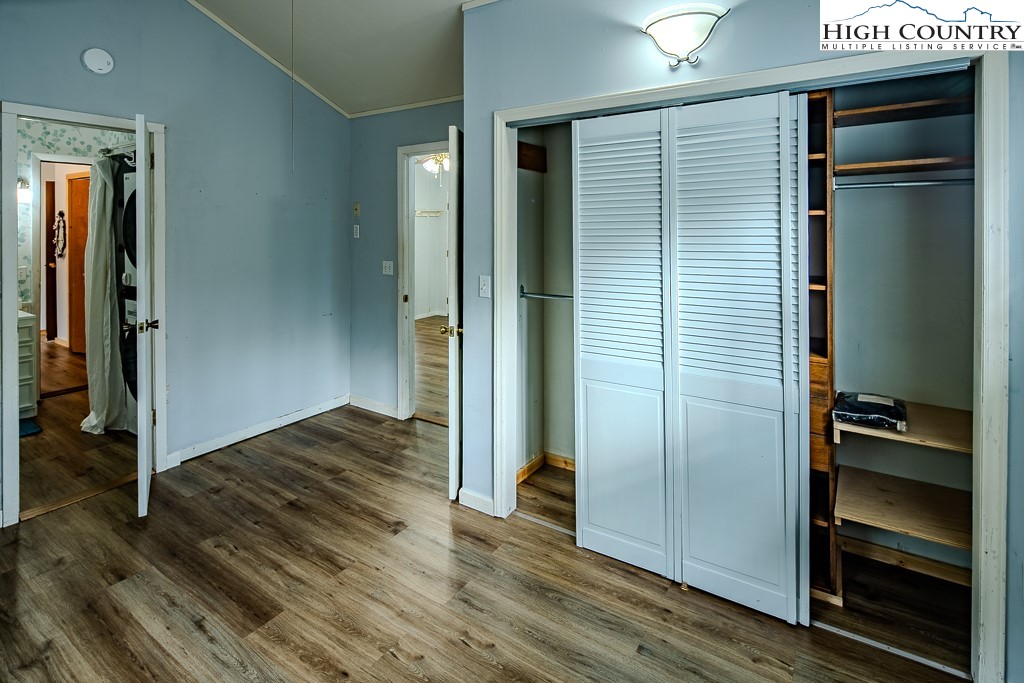 261 Black Pine Road Newland, NC 28657 - Photo 27 of 41 a view of a hallway with wooden floor and closet