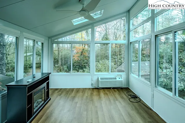 a wooden bench sitting in front of a building