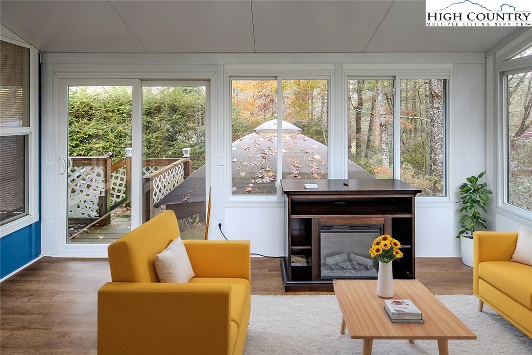 261 Black Pine Road Newland, NC 28657 - Photo 36 of 41 a living room with furniture and a fireplace