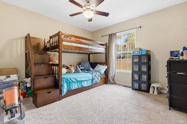 a bed room with a bed and a chair