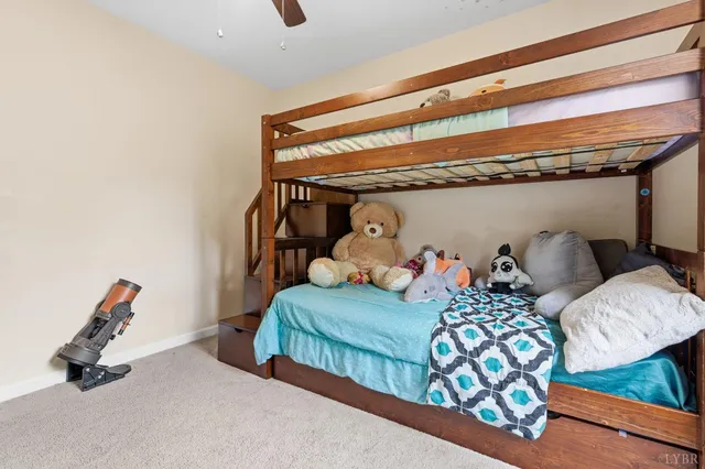 a bedroom with furniture and a wooden floor
