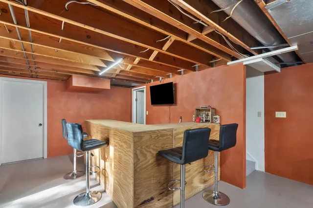 a view of a dining room with furniture and a table