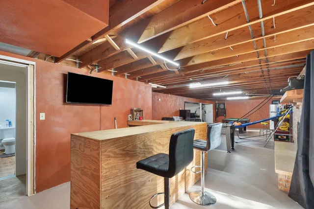 a view of a livingroom with furniture and a flat screen tv