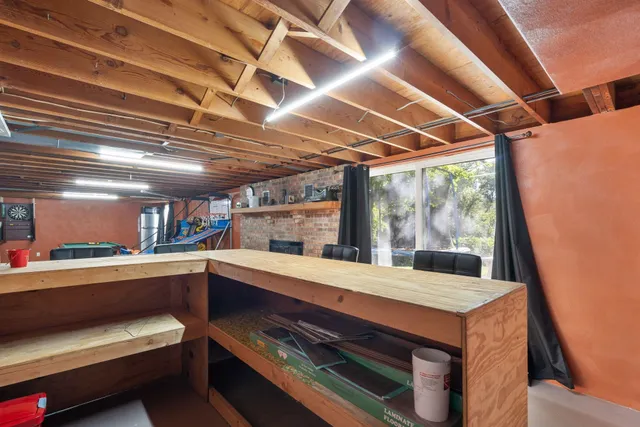 a view of a room with wooden floor and windows