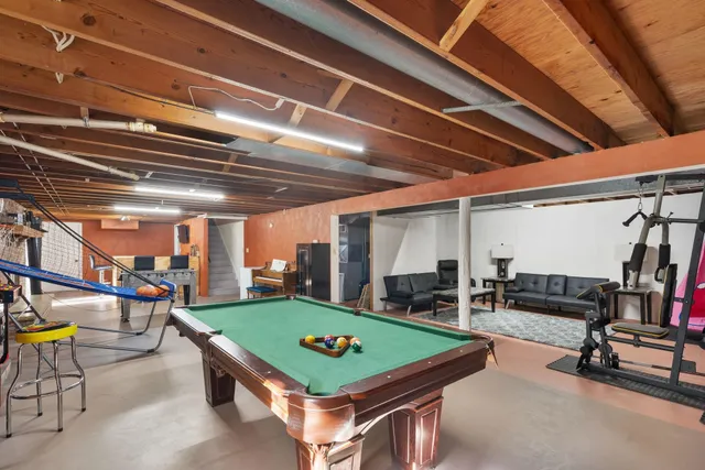 a room with lots of furniture and windows