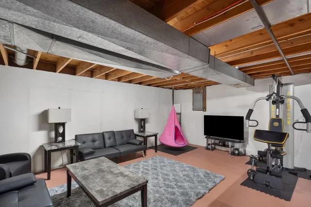 a view of a livingroom with furniture and a fireplace