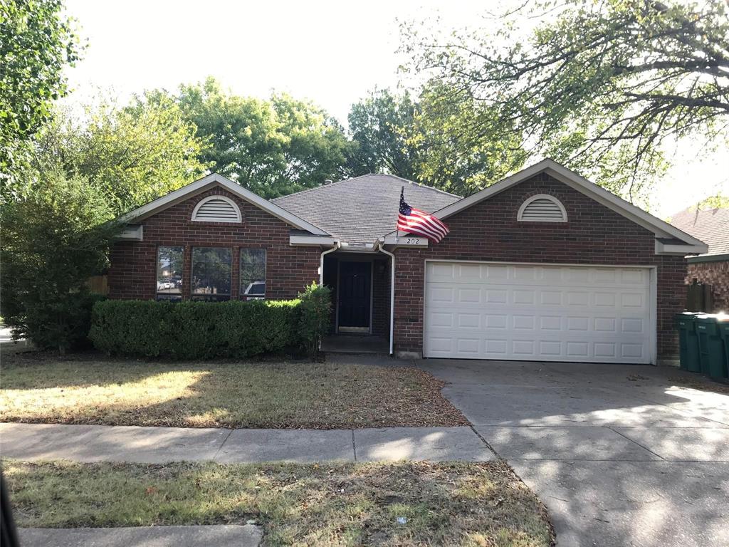 202 Ridgecrest Drive Cedar Hill, TX 75104 - Photo 1 of 1 a front view of a house with a yard and garage