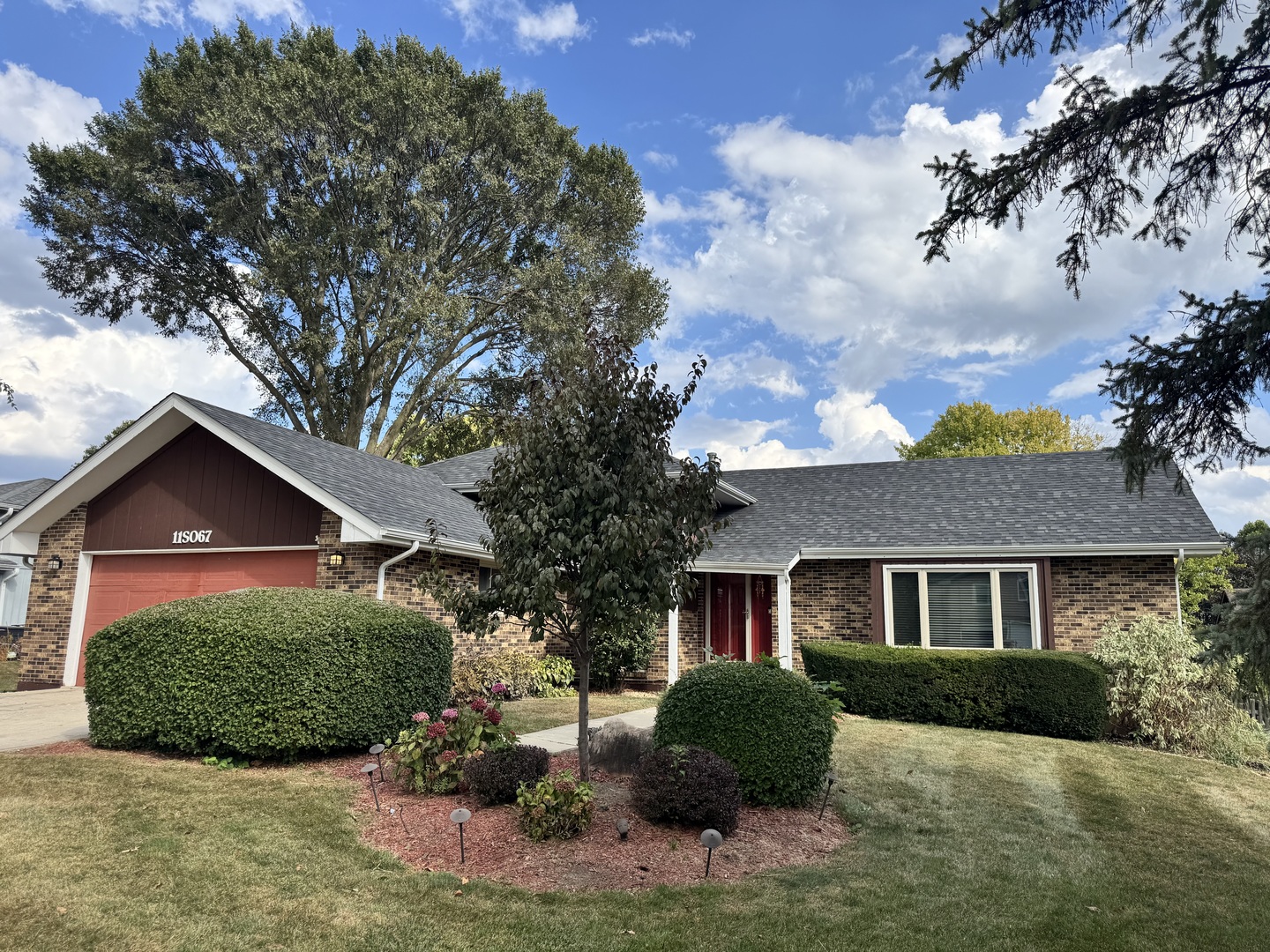 a view of a yard in front of a house