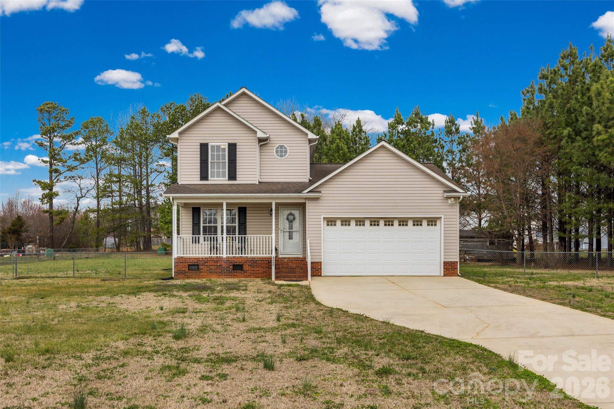4660 Garys Place Crouse, NC 28033 - Photo 2 of 32 a view of a house with a yard and potted plants