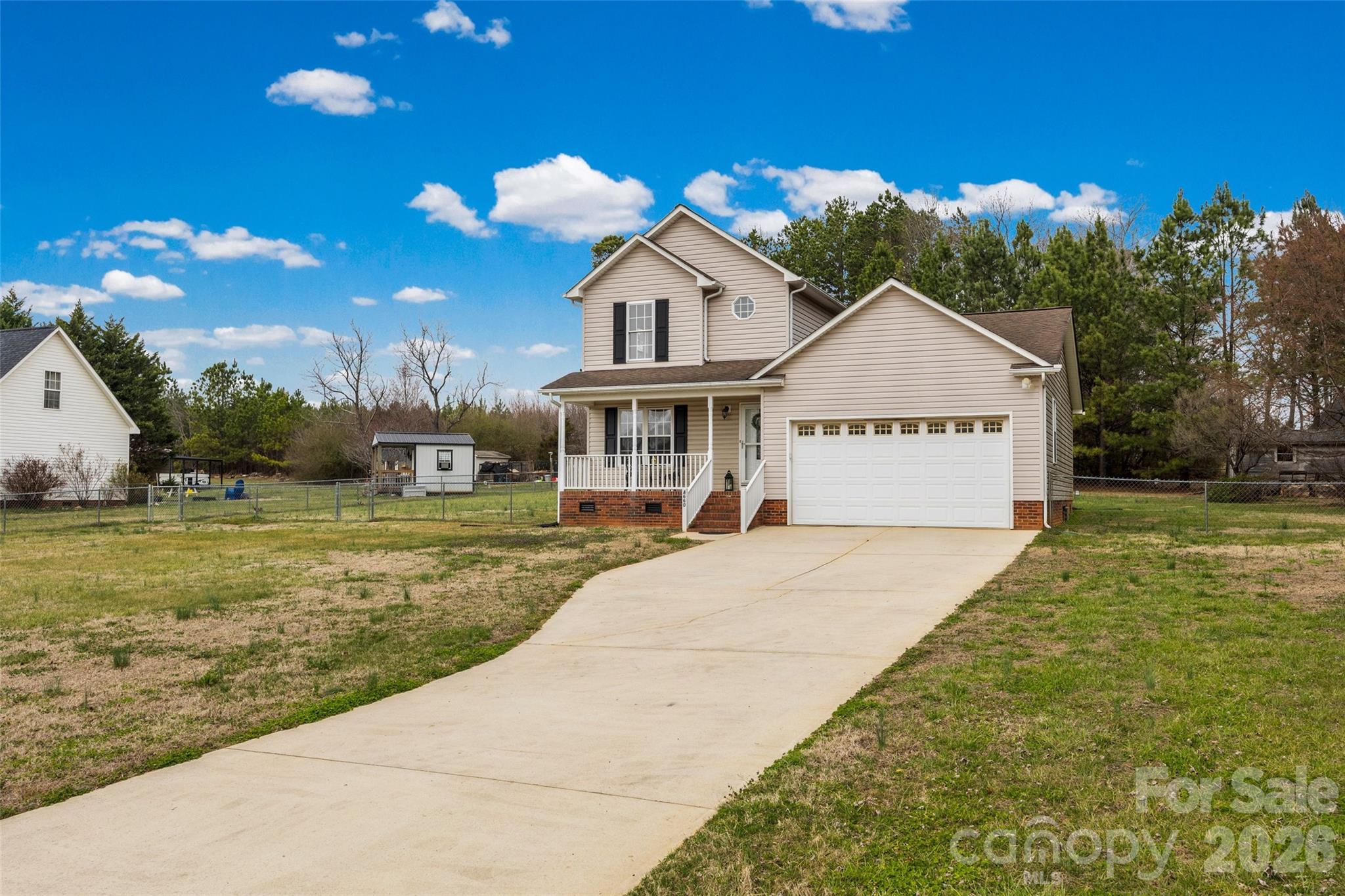 4660 Garys Place Crouse, NC 28033 - Photo 26 of 32 a front view of a house with garden