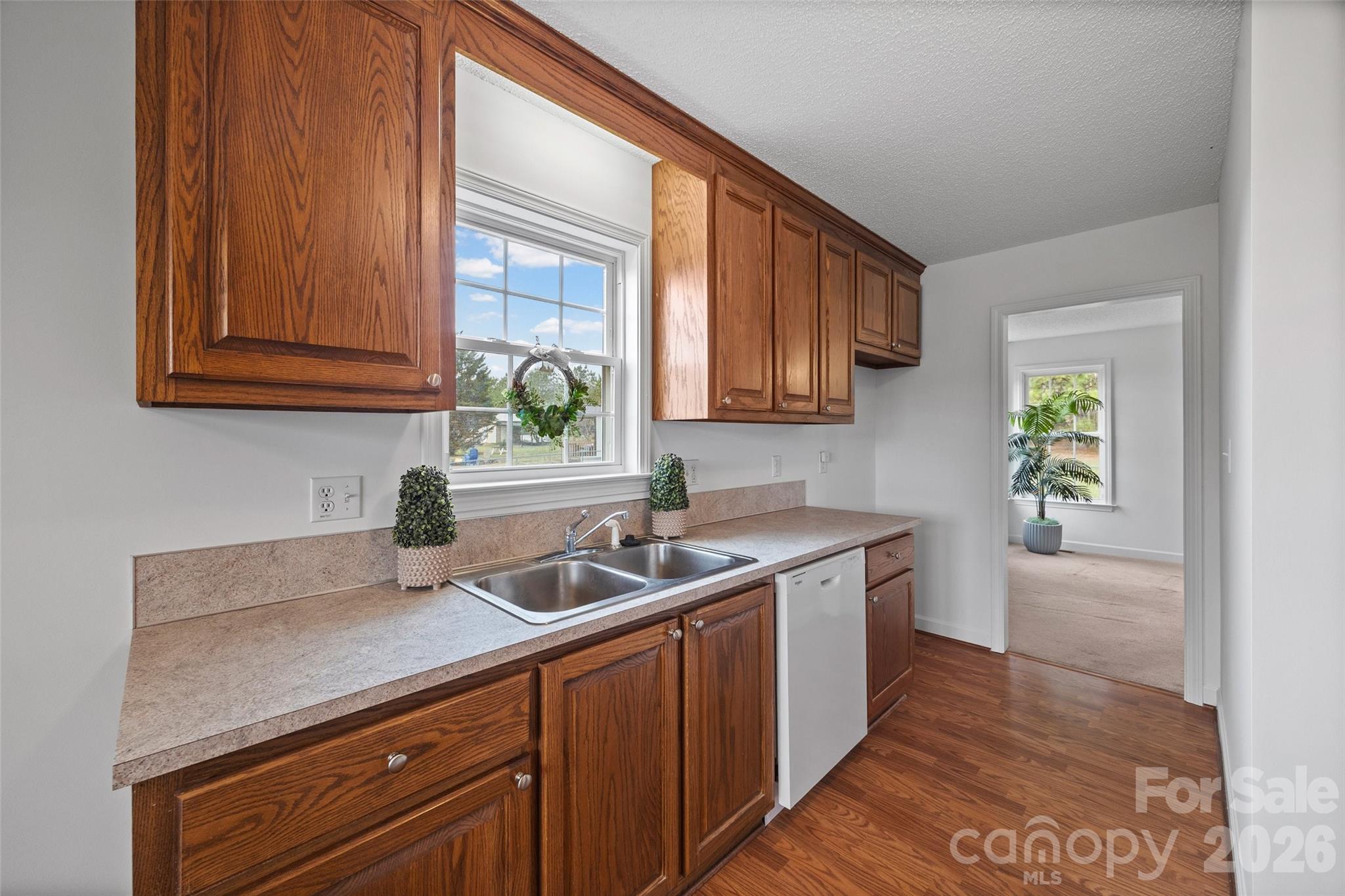 4660 Garys Place Crouse, NC 28033 - Photo 5 of 32 a kitchen with a sink stove and cabinets