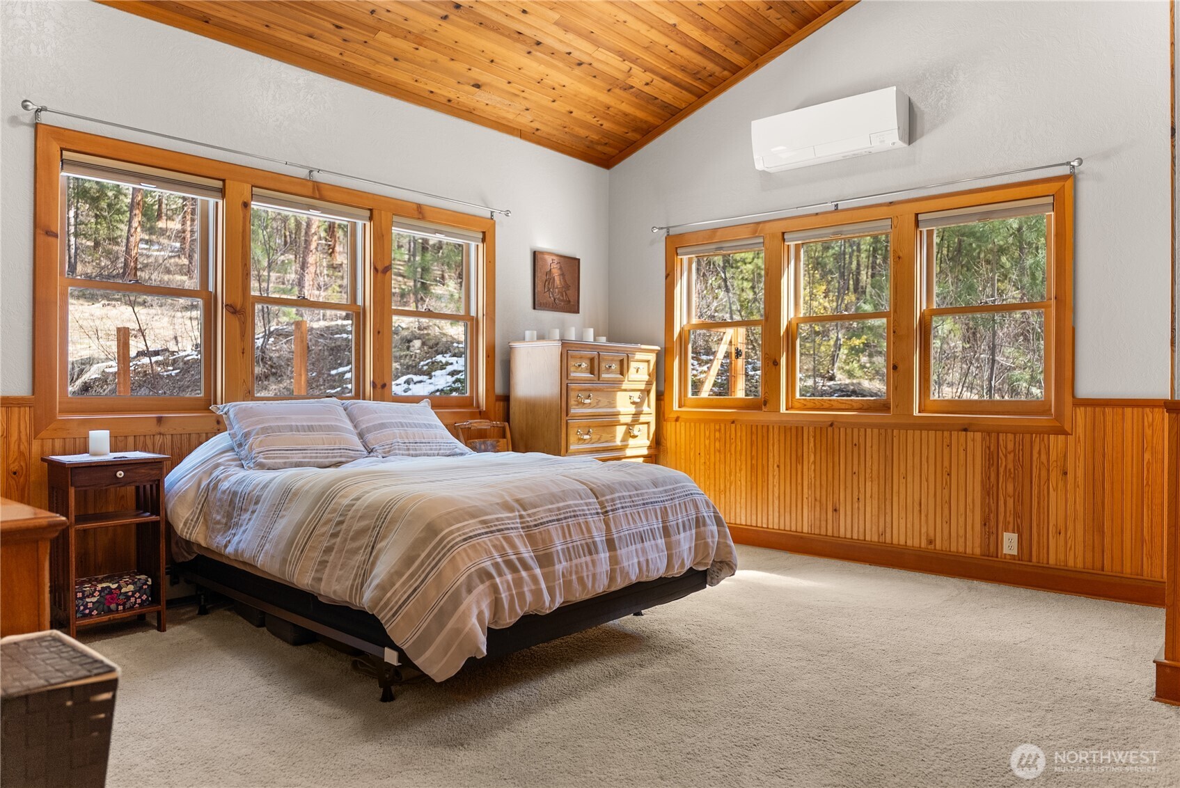 2 Trillium Road Winthrop, WA 98862 - Photo 16 of 40 a spacious bedroom with a bed lamp and a large window