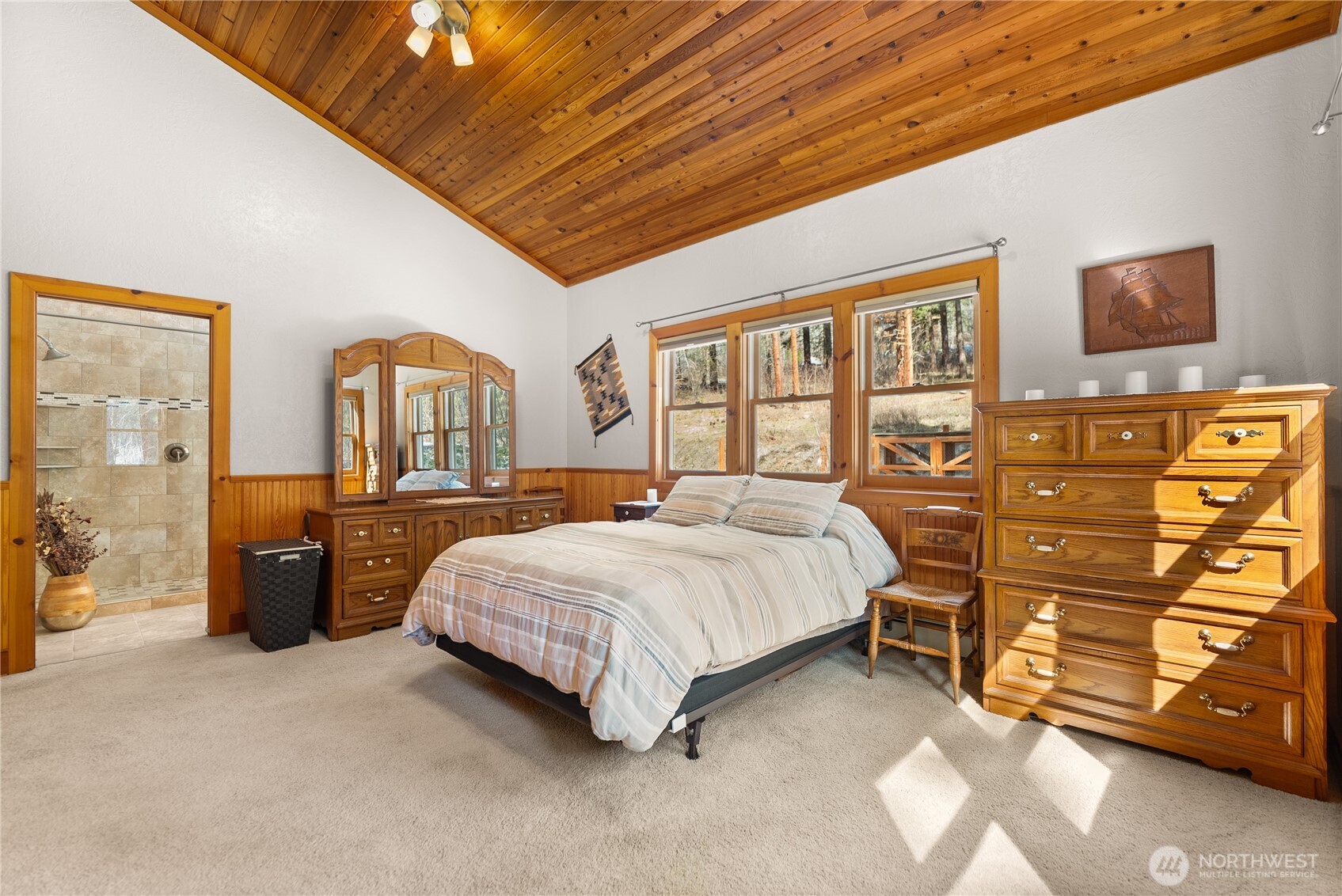2 Trillium Road Winthrop, WA 98862 - Photo 18 of 40 a spacious bedroom with a bed and dresser
