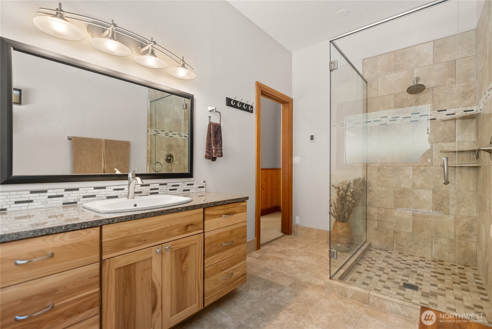 2 Trillium Road Winthrop, WA 98862 - Photo 20 of 40 a bathroom with a shower sink and mirror