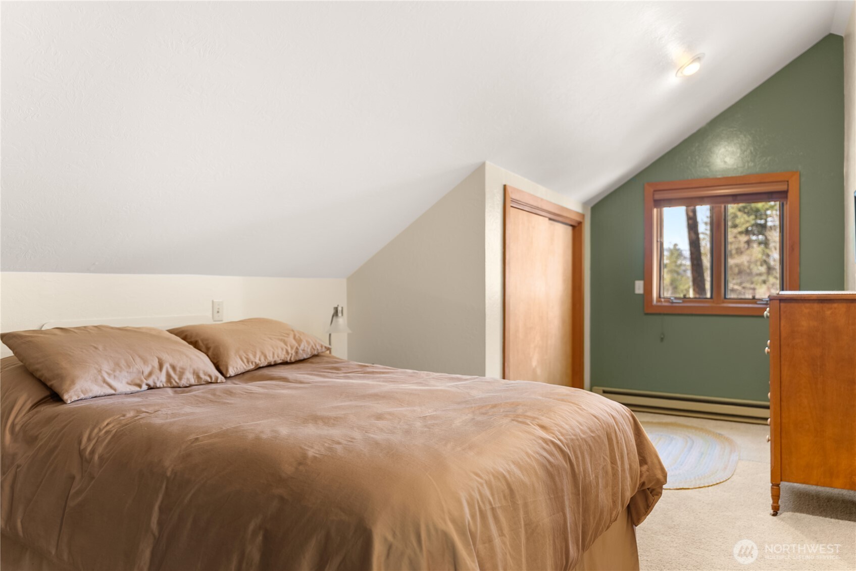 2 Trillium Road Winthrop, WA 98862 - Photo 25 of 40 a bedroom with a bed and windows