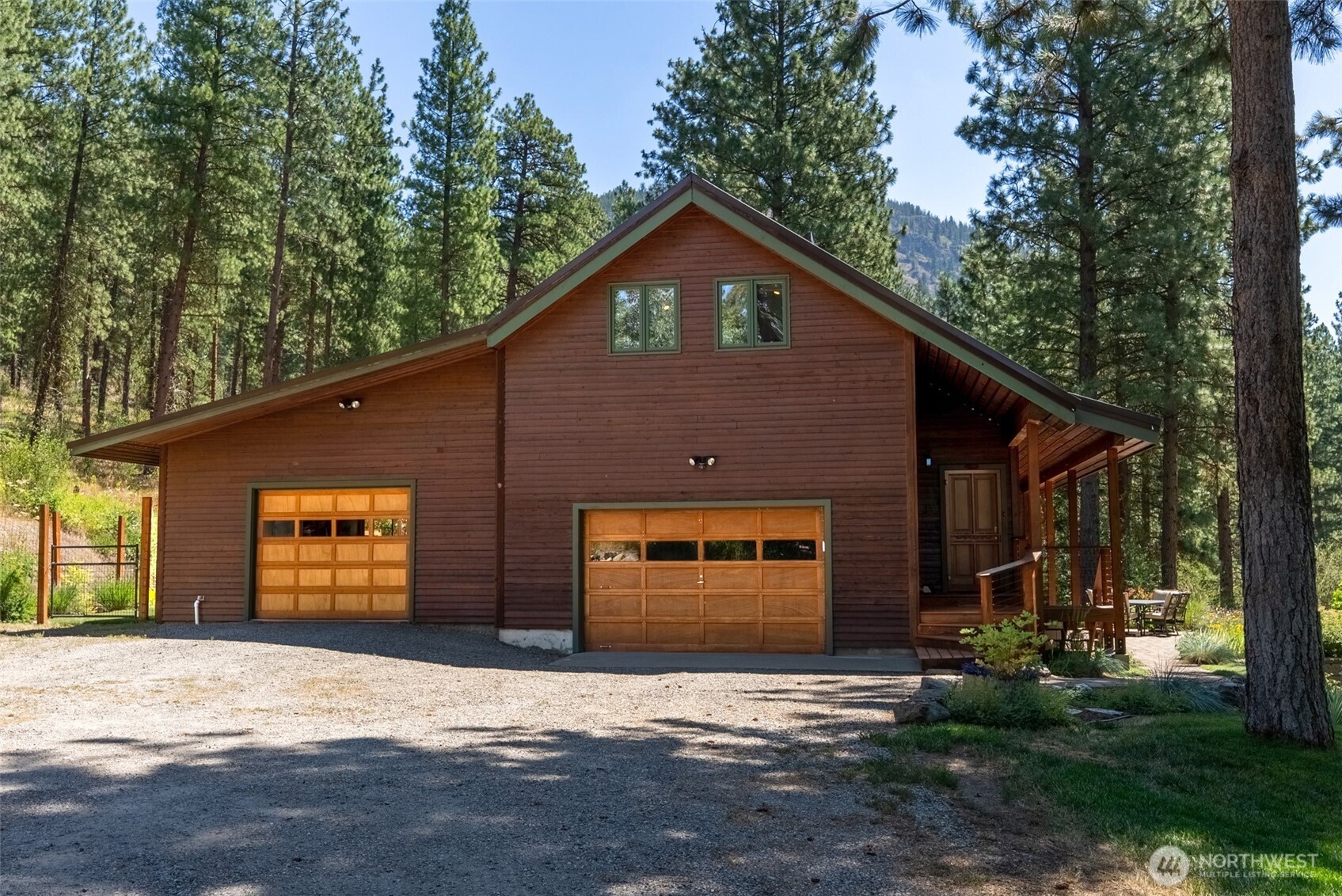 2 Trillium Road Winthrop, WA 98862 - Photo 3 of 40 a front view of house with yard and trees in the background