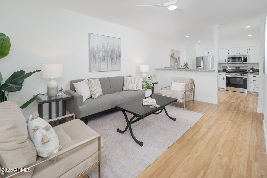 720 South Dobson Road, Unit 85 Mesa, AZ 85202 - Photo 1 of 16 a living room with furniture and kitchen view