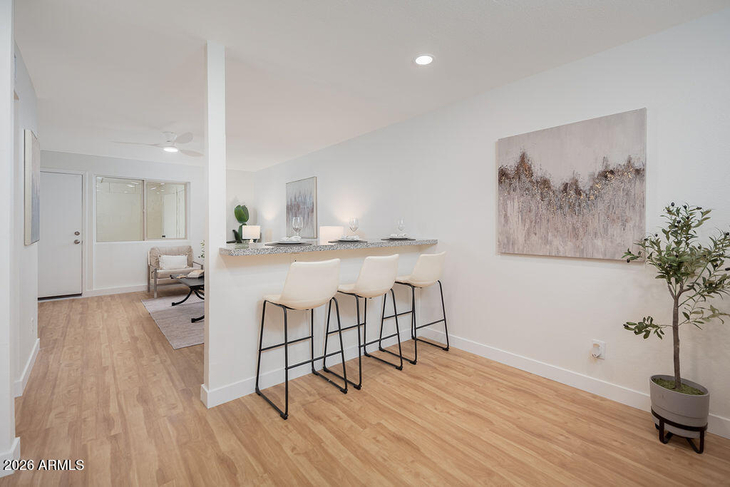 720 South Dobson Road, Unit 85 Mesa, AZ 85202 - Photo 5 of 16 a living room with furniture and wooden floor
