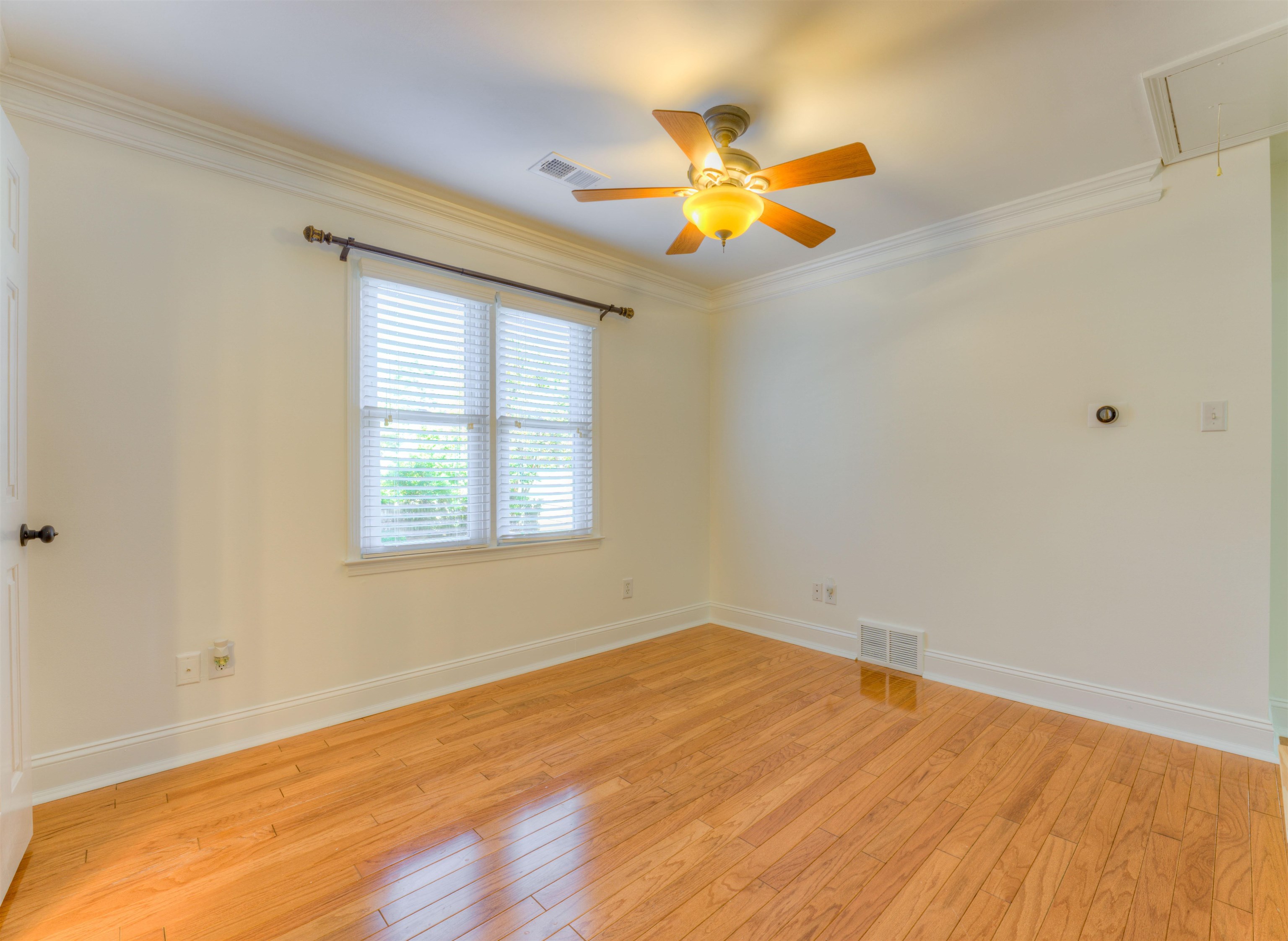 3385 Beaver Run Drive Collierville, TN 38017 - Photo 14 of 24 a view of an empty room with wooden floor and a window