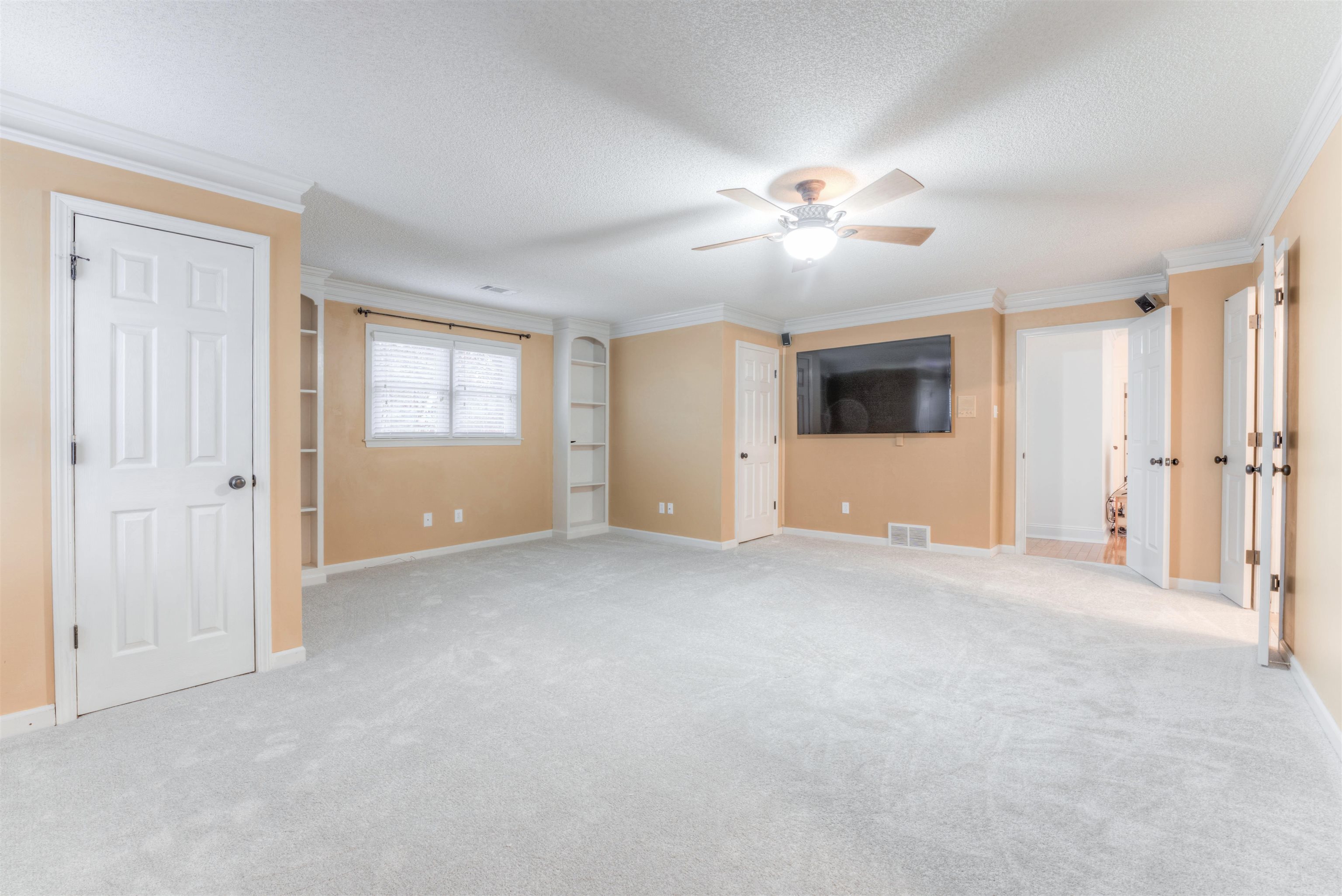 3385 Beaver Run Drive Collierville, TN 38017 - Photo 16 of 24 a view of an empty room with a ceiling fan and window