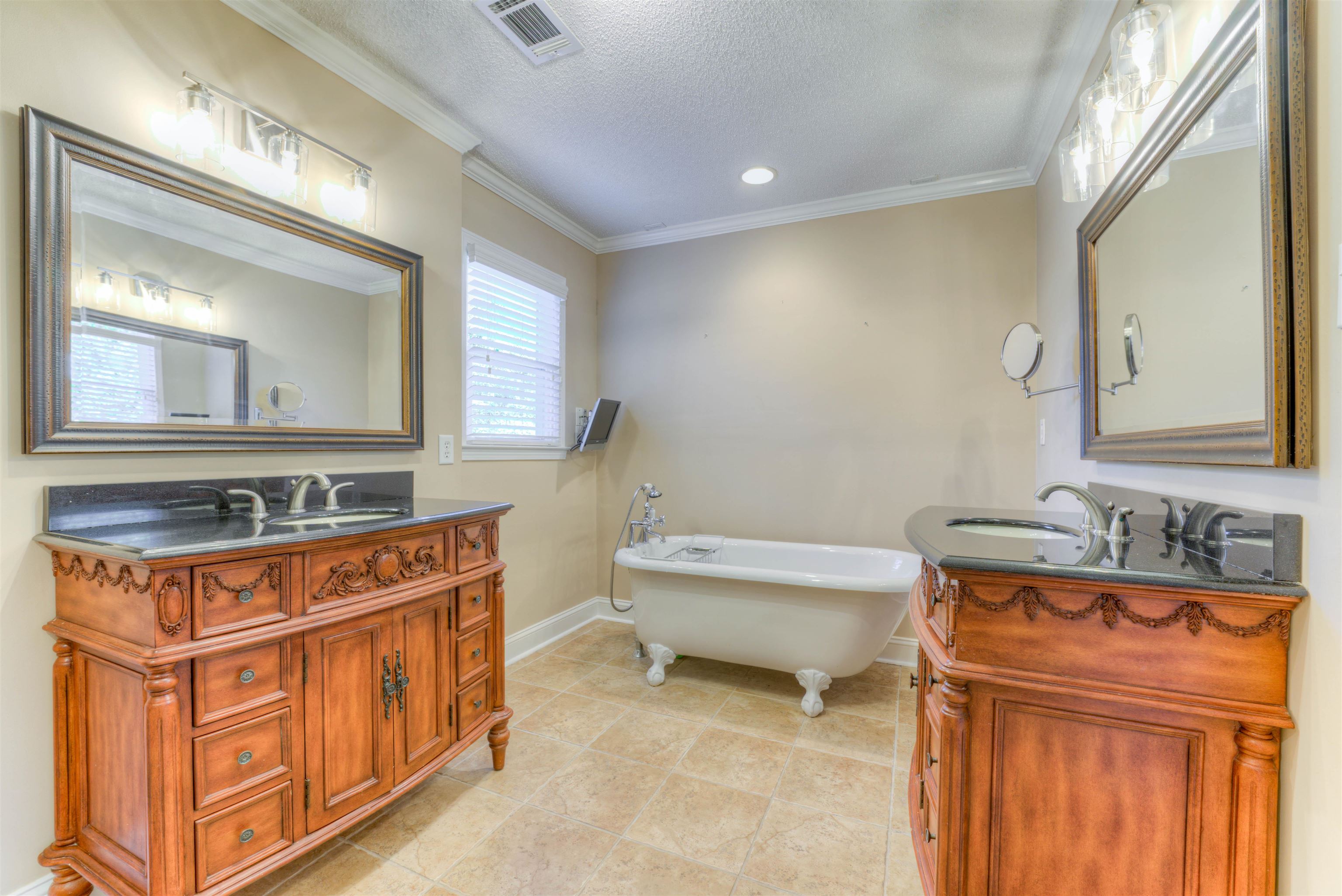 3385 Beaver Run Drive Collierville, TN 38017 - Photo 17 of 24 a bathroom with a sink a mirror a toilet and a window