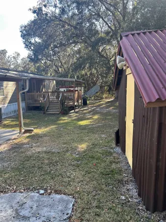a view of a house with backyard