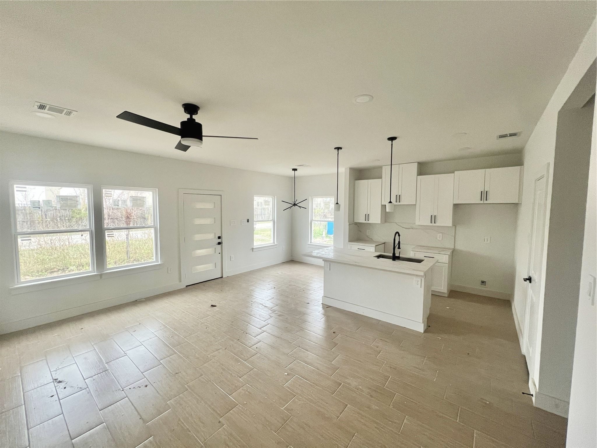 5710 Delmack Street, Unit B Houston, TX 77032 - Photo 7 of 30 Living Room, Dining, & Kitchen