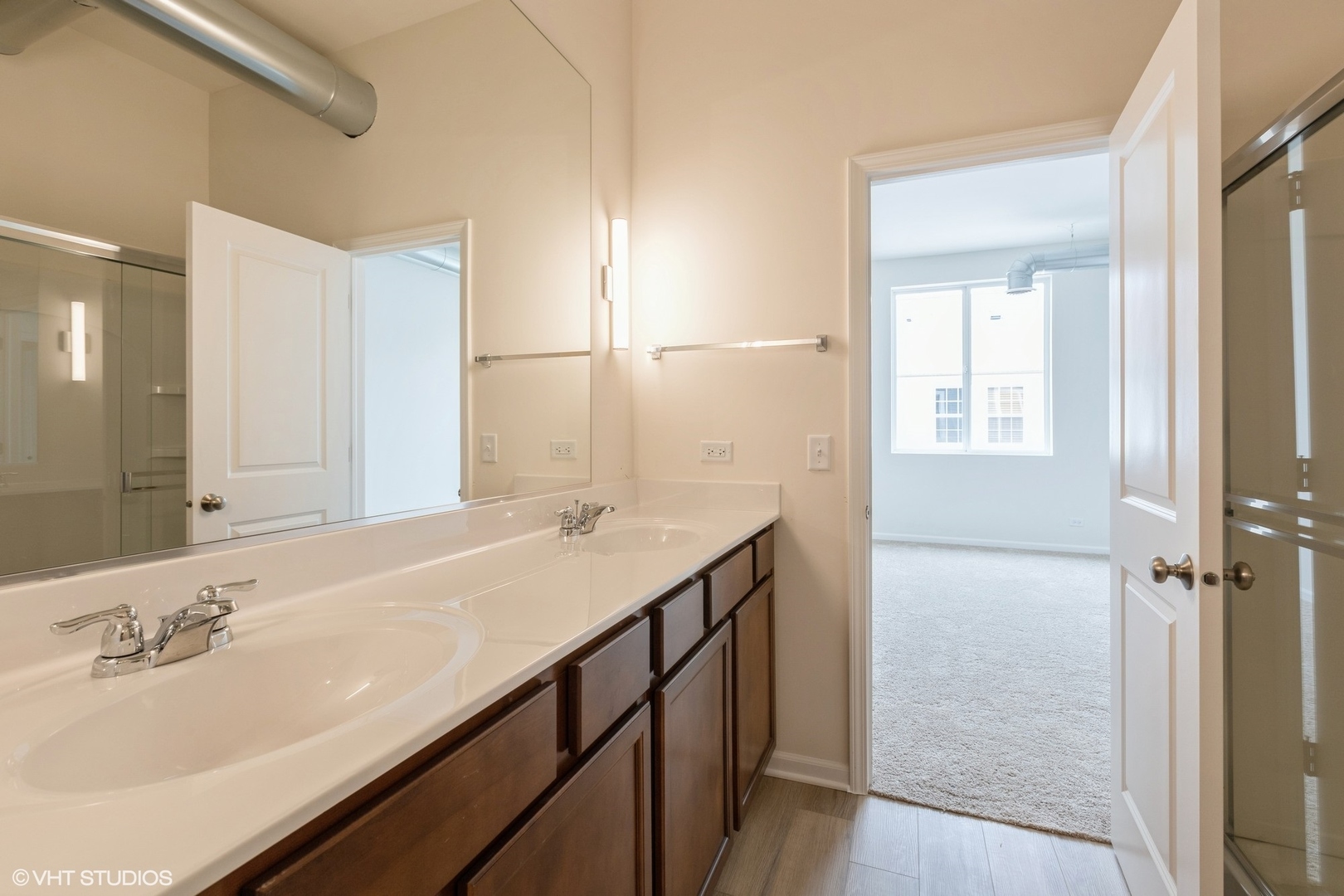 1690 Simms Street Aurora, IL 60504 - Photo 11 of 24 a bathroom with a sink and a mirror