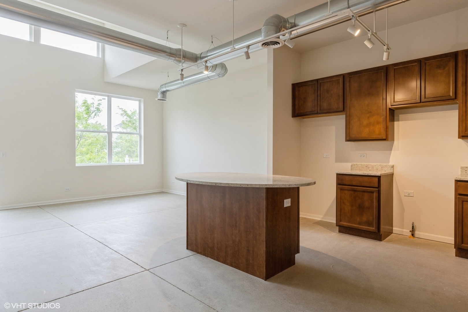 1690 Simms Street Aurora, IL 60504 - Photo 18 of 24 a view of an empty room with a fireplace and a window