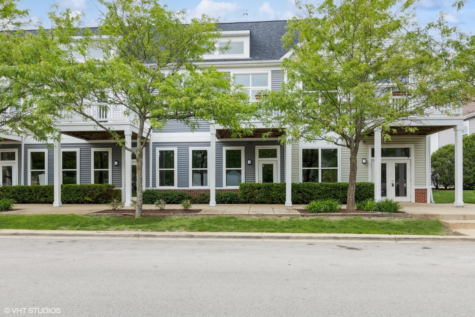 1690 Simms Street Aurora, IL 60504 - Photo 2 of 24 front view of a brick house with a yard