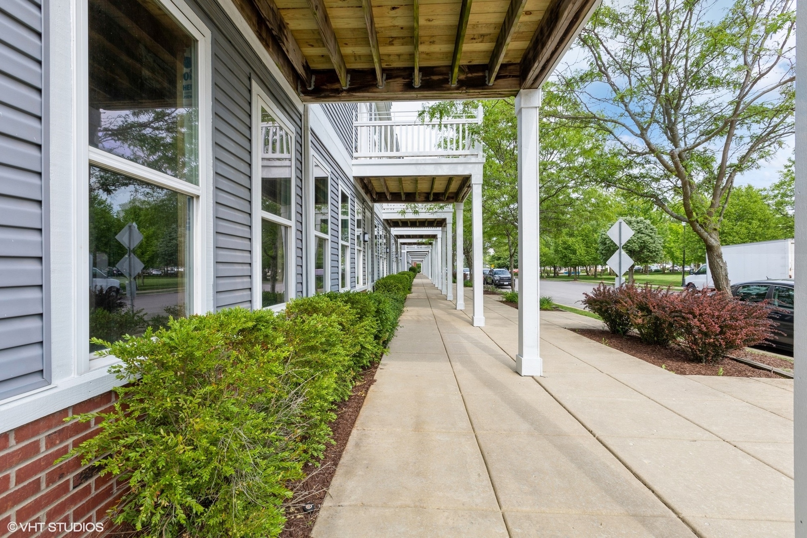 1690 Simms Street Aurora, IL 60504 - Photo 4 of 24 a view of a porch with furniture and a yard