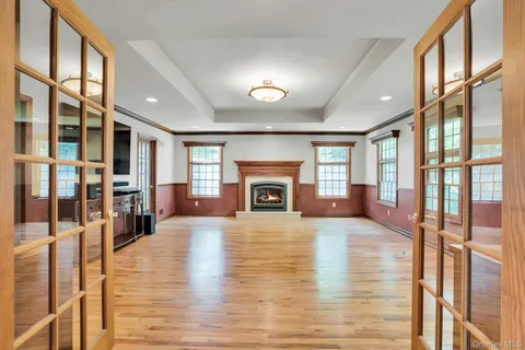 a living room with fireplace furniture and a fireplace