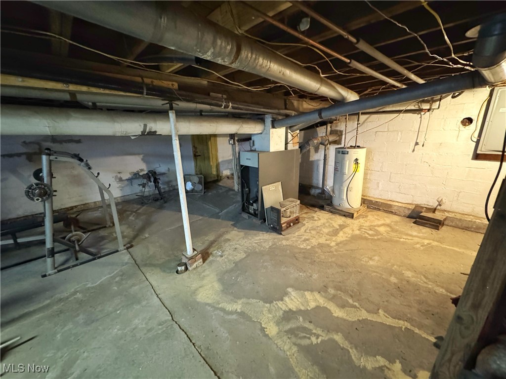 72117 Barton Road Bridgeport, OH 43912 - Photo 32 of 42 Unfinished basement with water heater and heating unit