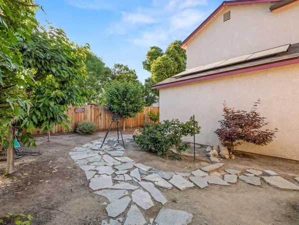 a view of a back yard of the house
