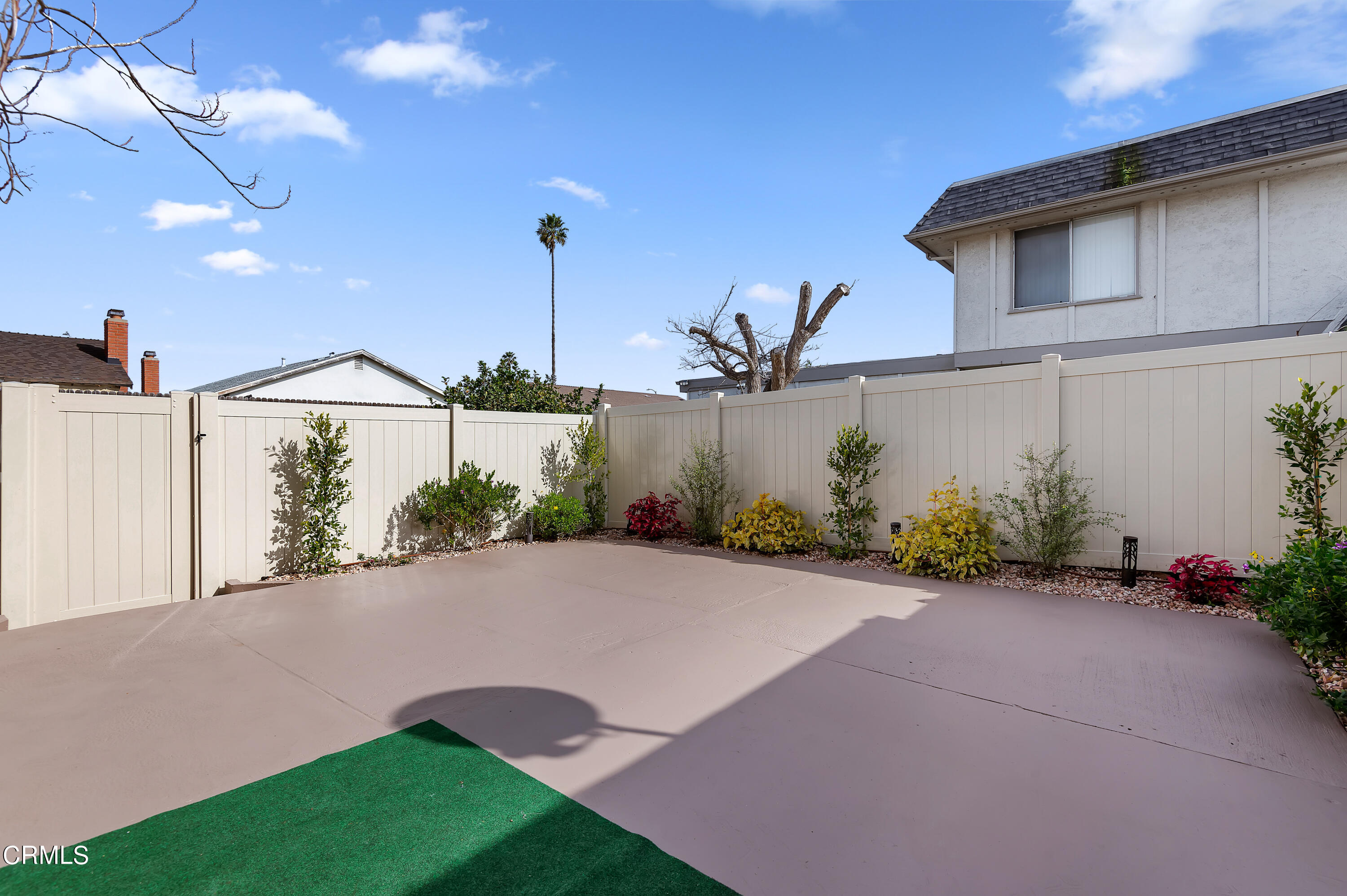 3701 Ketch Avenue, Unit D Oxnard, CA 93035 - Photo 25 of 28 a front view of a house with garden