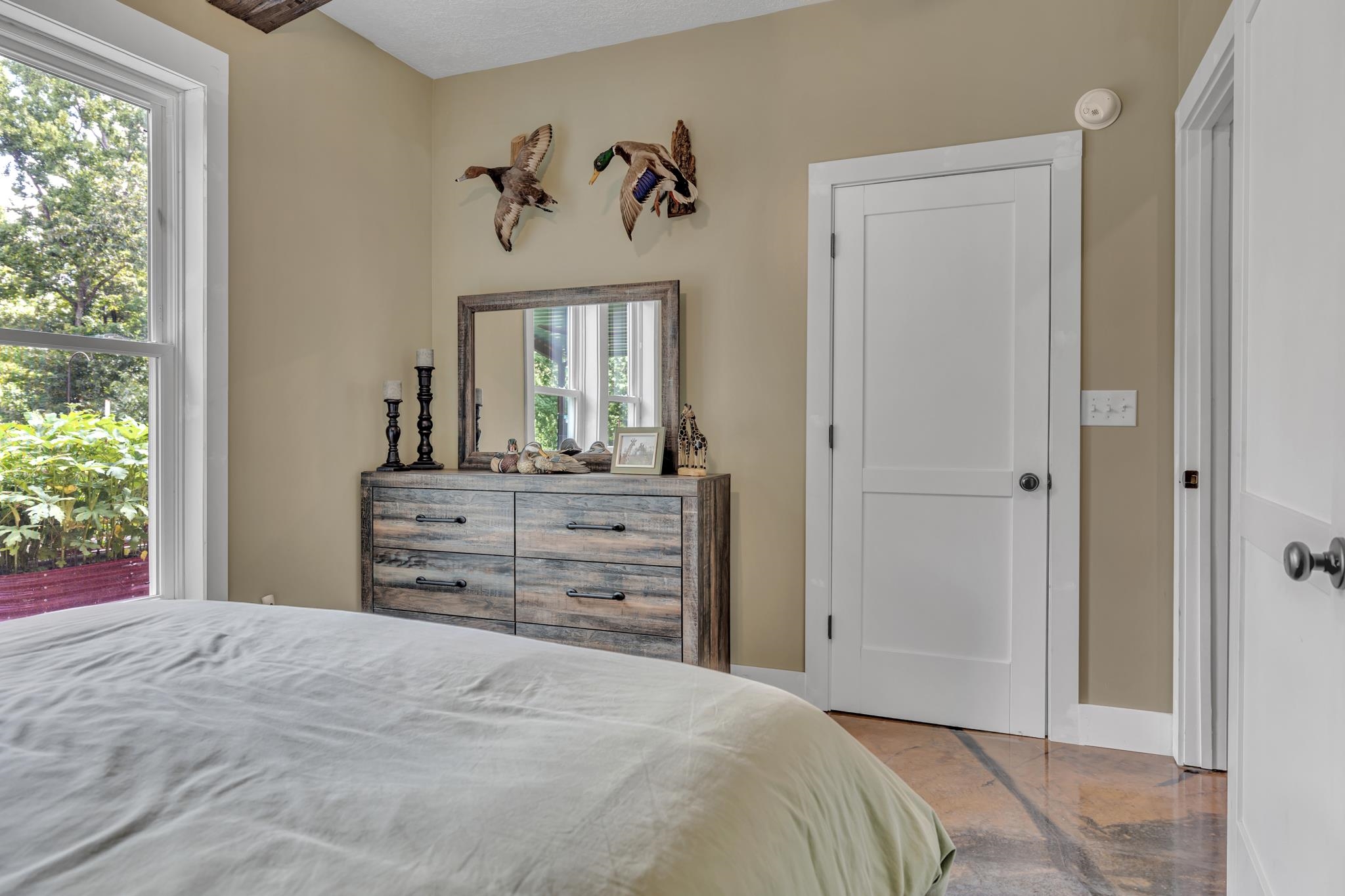 350 Hamilton Road Springville, TN 38256 - Photo 23 of 40 Large window overlooking lush greenery, white two-panel interior doors, and a wood-finish ceiling accent