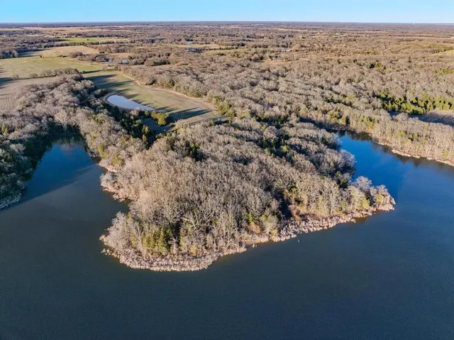 an aerial view of house with yard